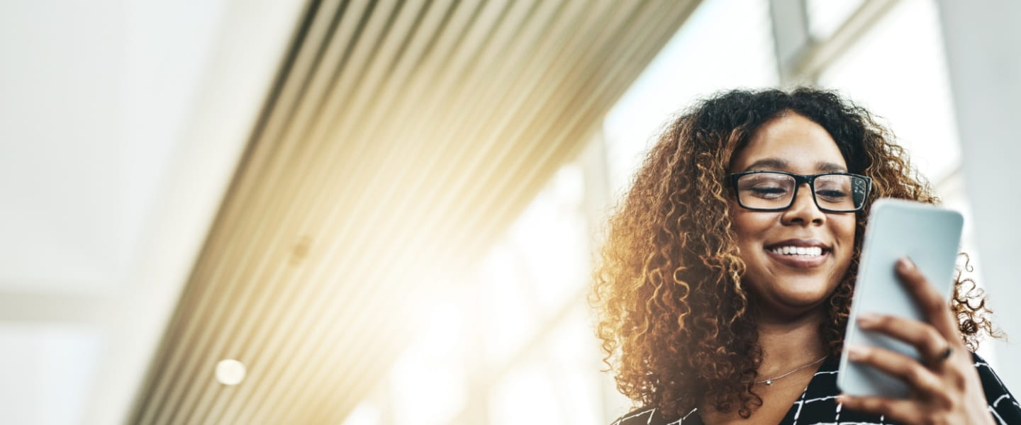 A women looking at a smartphone
