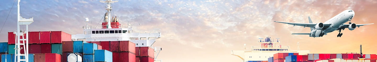 a plane flying over a loading dock