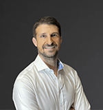 Damien Delard profile 2022 Dark Grey head shot Damien Delard profile 2022 Dark Grey head shot