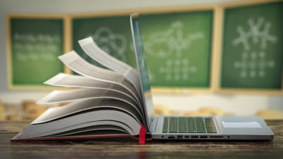 a laptop and a book a laptop and a book