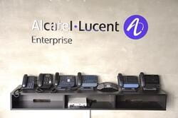 a table covered with telephones