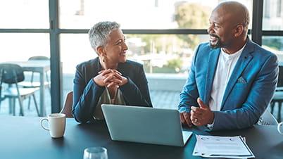 a man and woman sitting at a table a man and woman sitting at a table