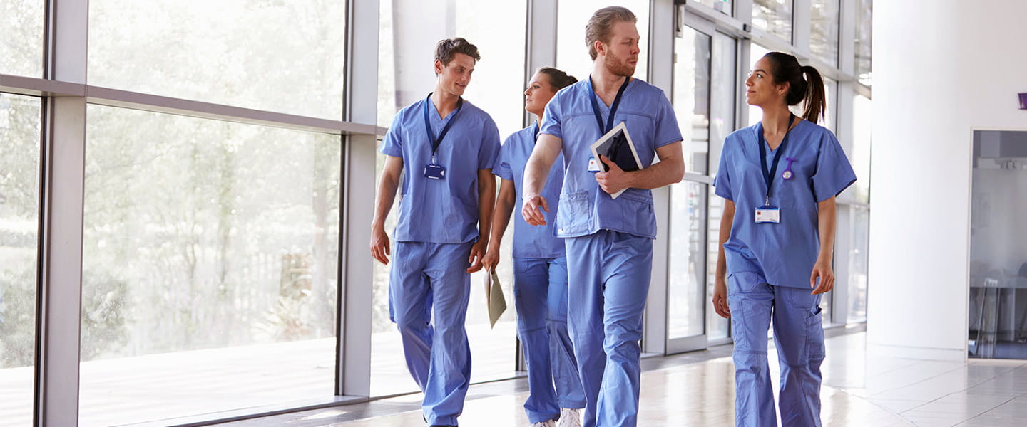 istituto ortopedico rizzoli, 3 hospital workers in blue clothes