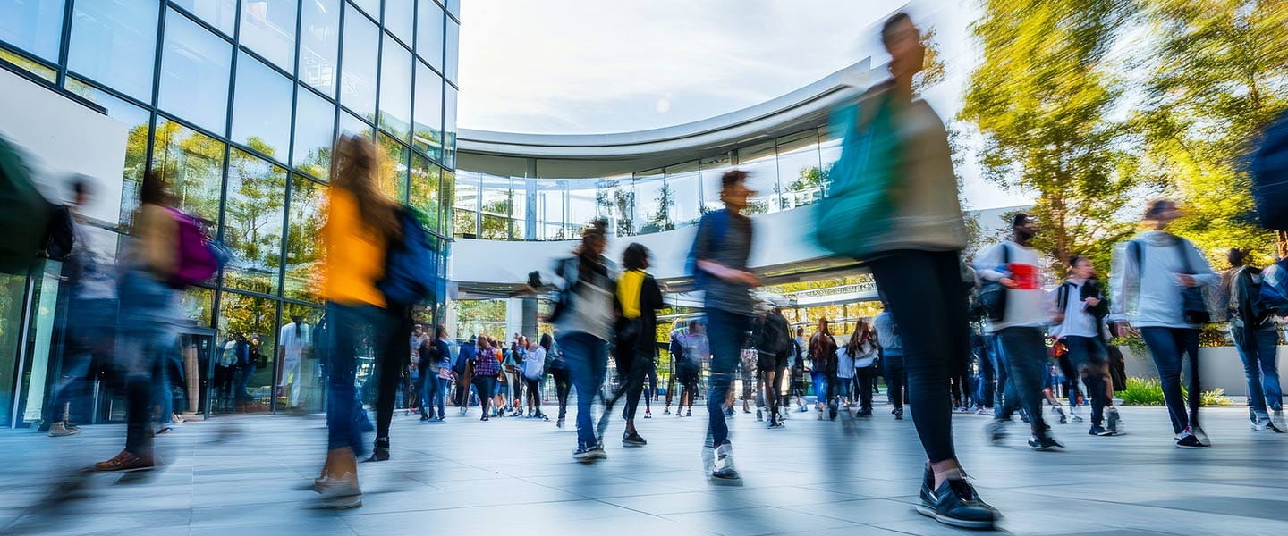 Campus lobby with many students walking