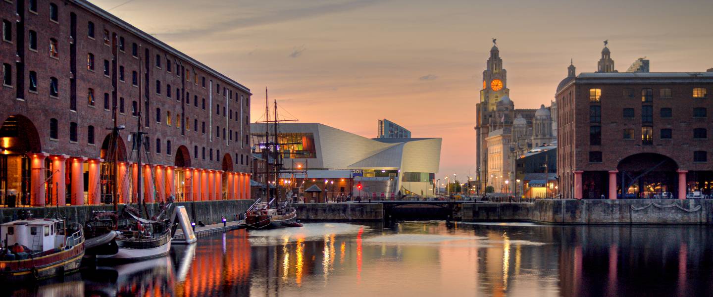a body of water with boats in it and buildings around it