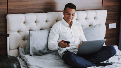 Man working from hotel room Man working from hotel room