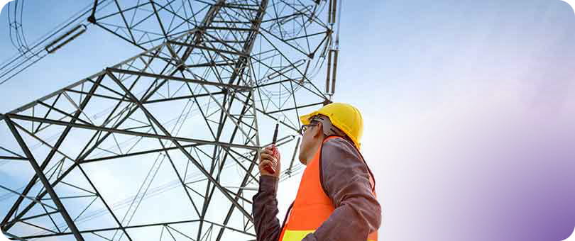 transmission tower worker on phone