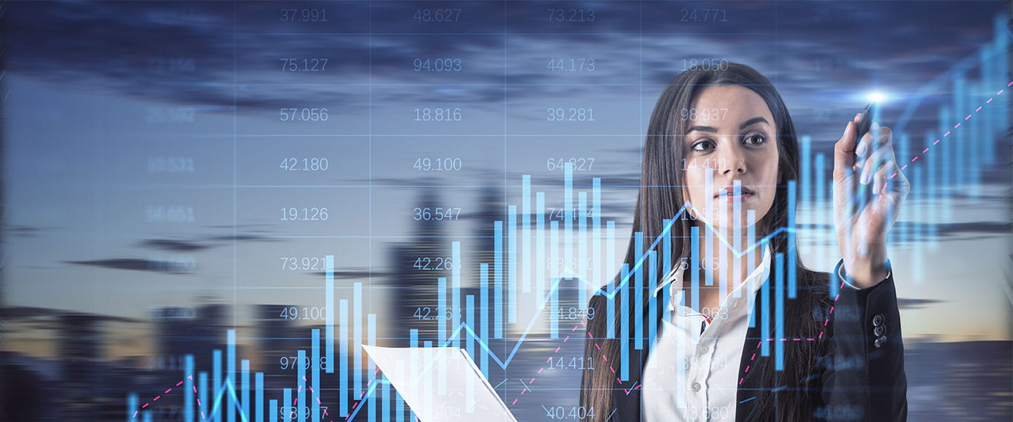 A man and woman looking at a laptop