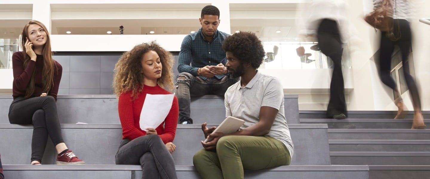 a group of people sitting on a bench