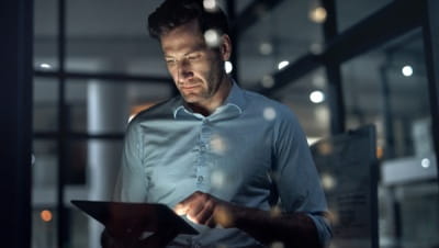 Man looking at a laptop Man looking at a laptop